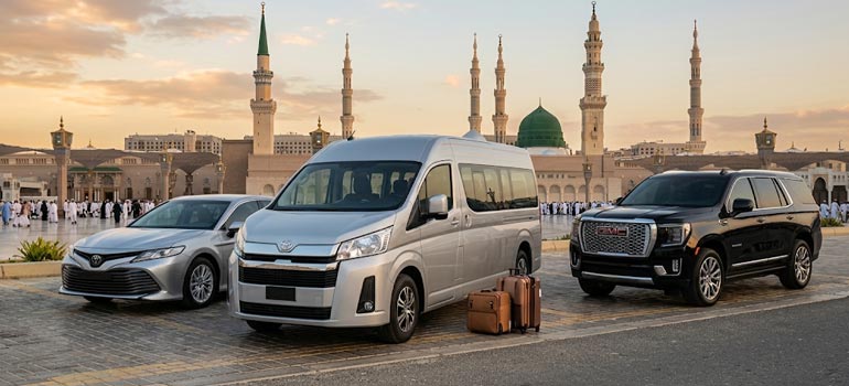 Private transport fleet of sedan, van and SUV parked near Prophet’s Mosque with green dome in Madinah.